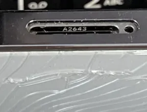 close up of an iPhone Model Number A2643 located in the sim tray
